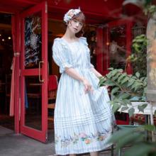 model wearing the cute white dress with light blue stripes